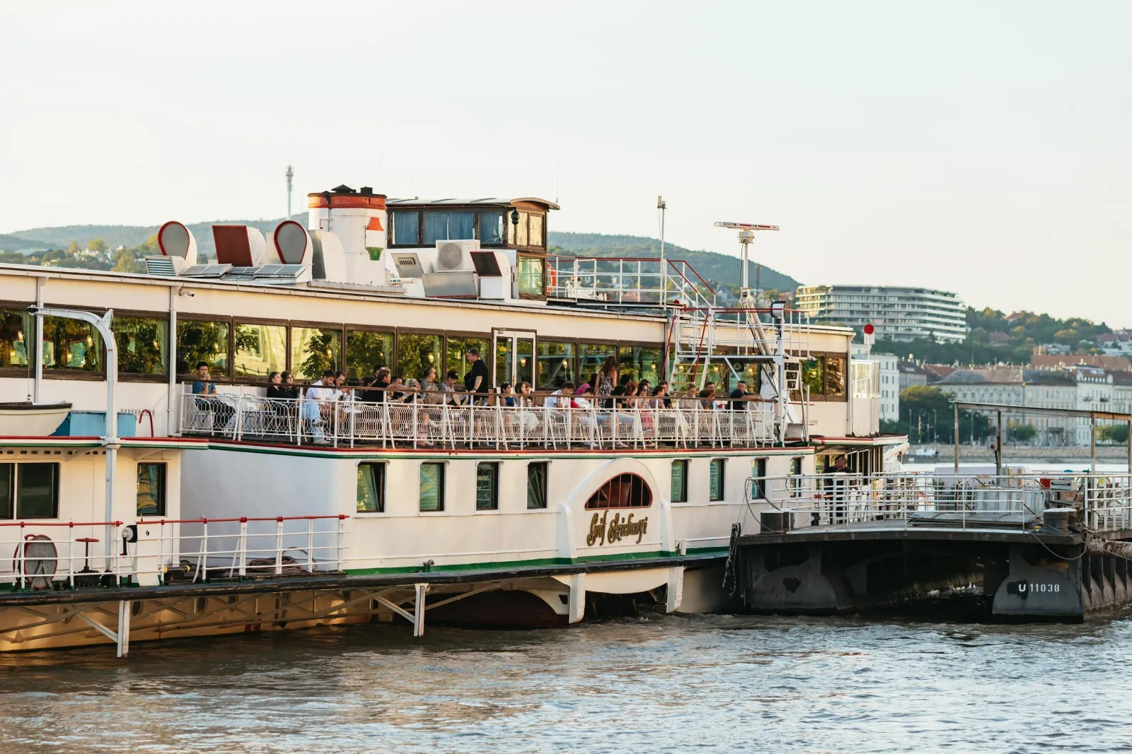 The cruise boat moored at the Pest embankment by day