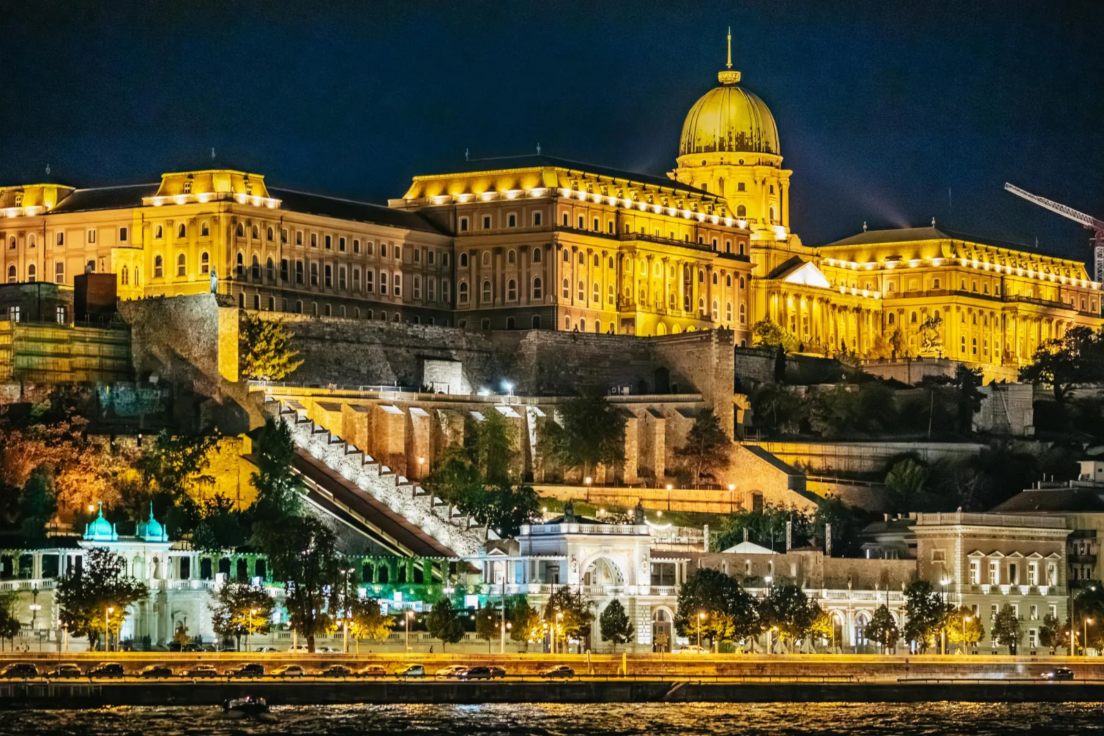 Buda Castle floodlit above the river at night