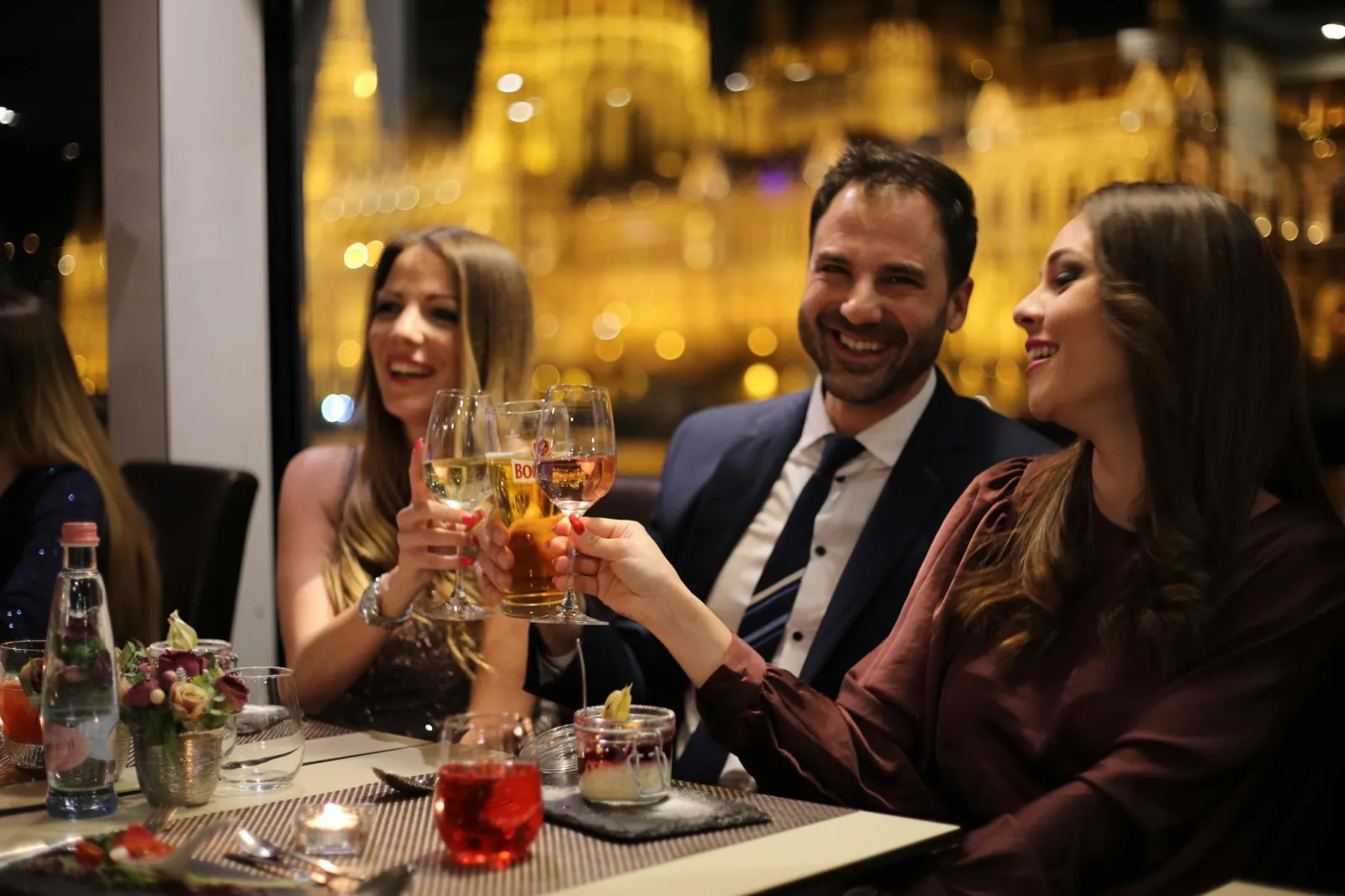 Guests toasting at a Christmas dinner table